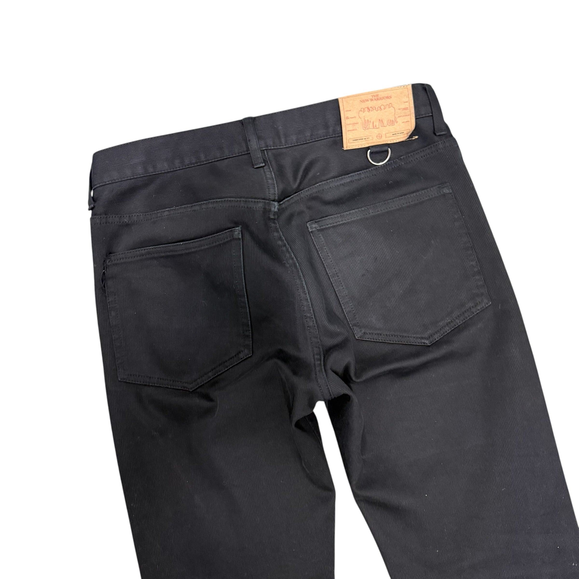 UNDERCOVER FLARED THUNDERBOLT DENIM PANTS.