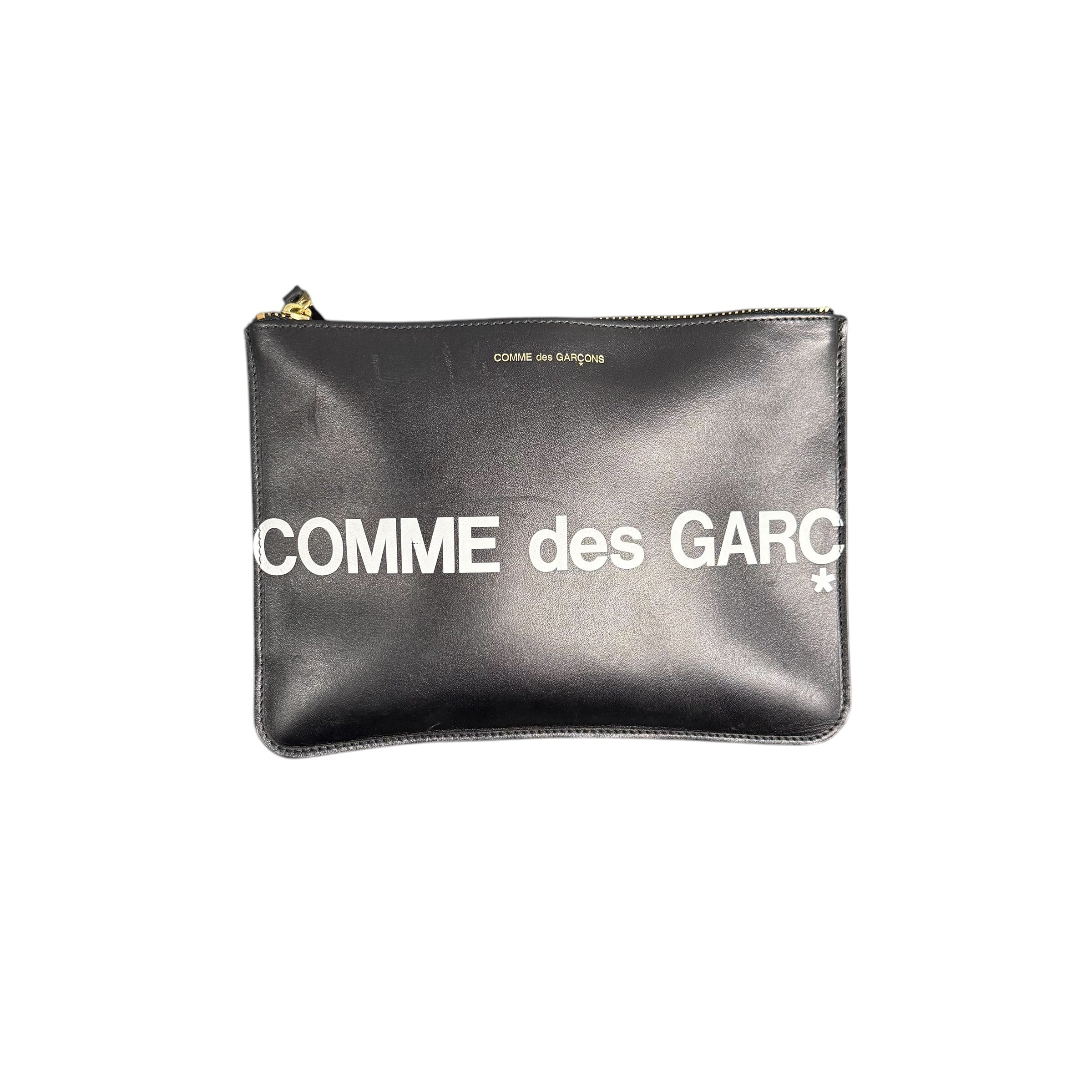 COMME DES GARCONS LEATHER POUCH.