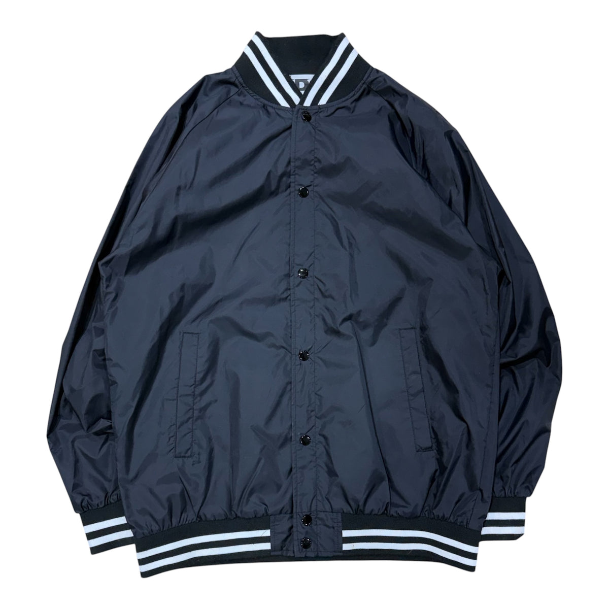 BLACK CDG COACH JACKET.
