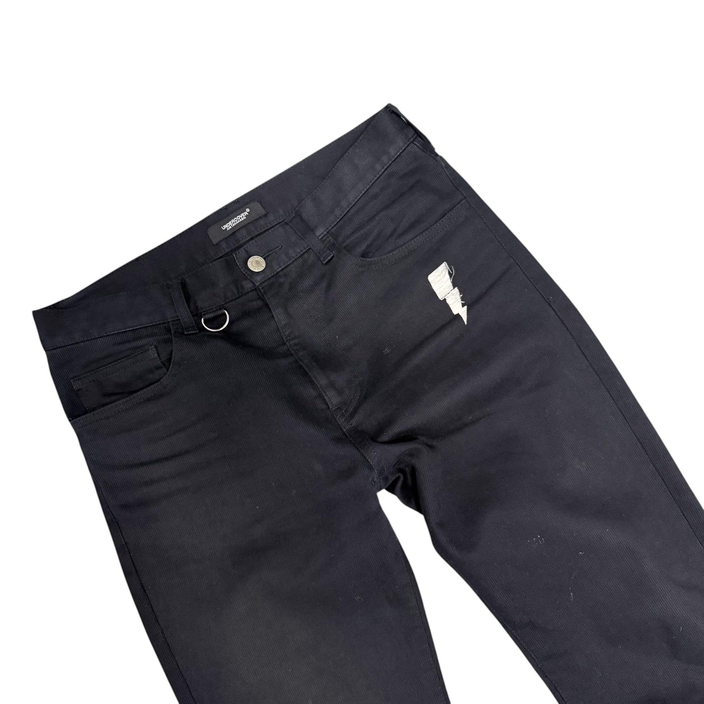 UNDERCOVER FLARED THUNDERBOLT DENIM PANTS.