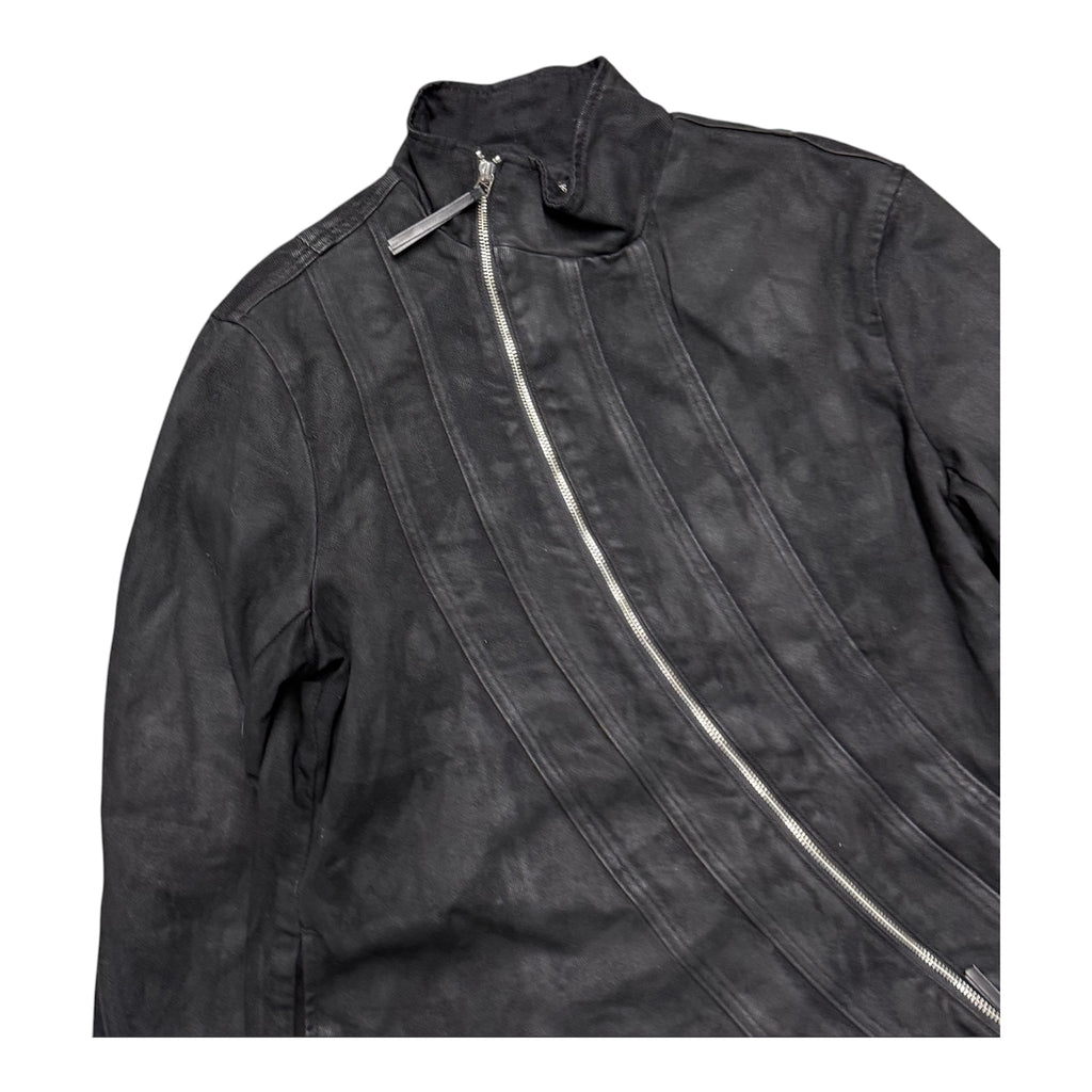 TROUBLED WATERS ASYMMETRICAL WAXED JACKET.