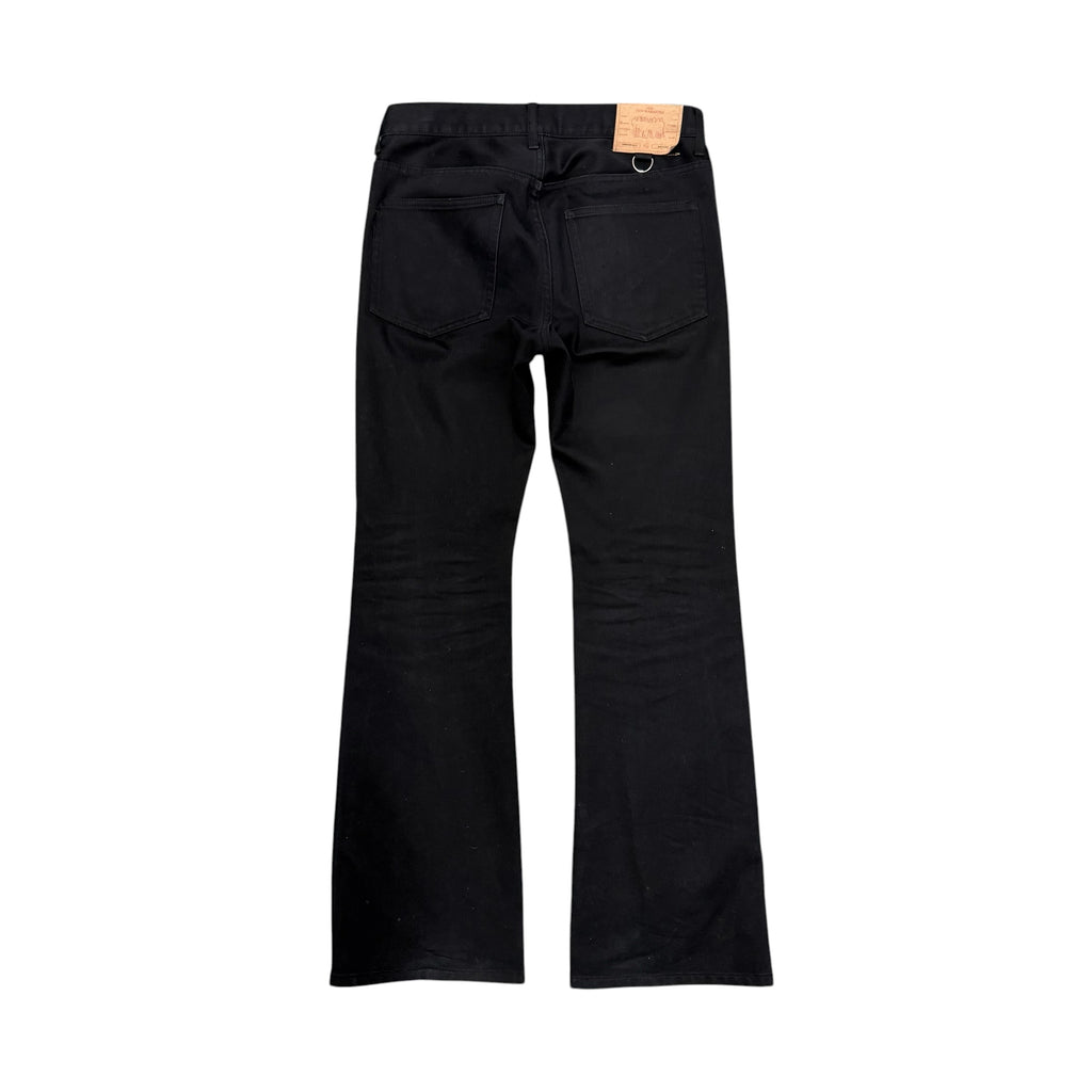 UNDERCOVER FLARED THUNDERBOLT DENIM PANTS.