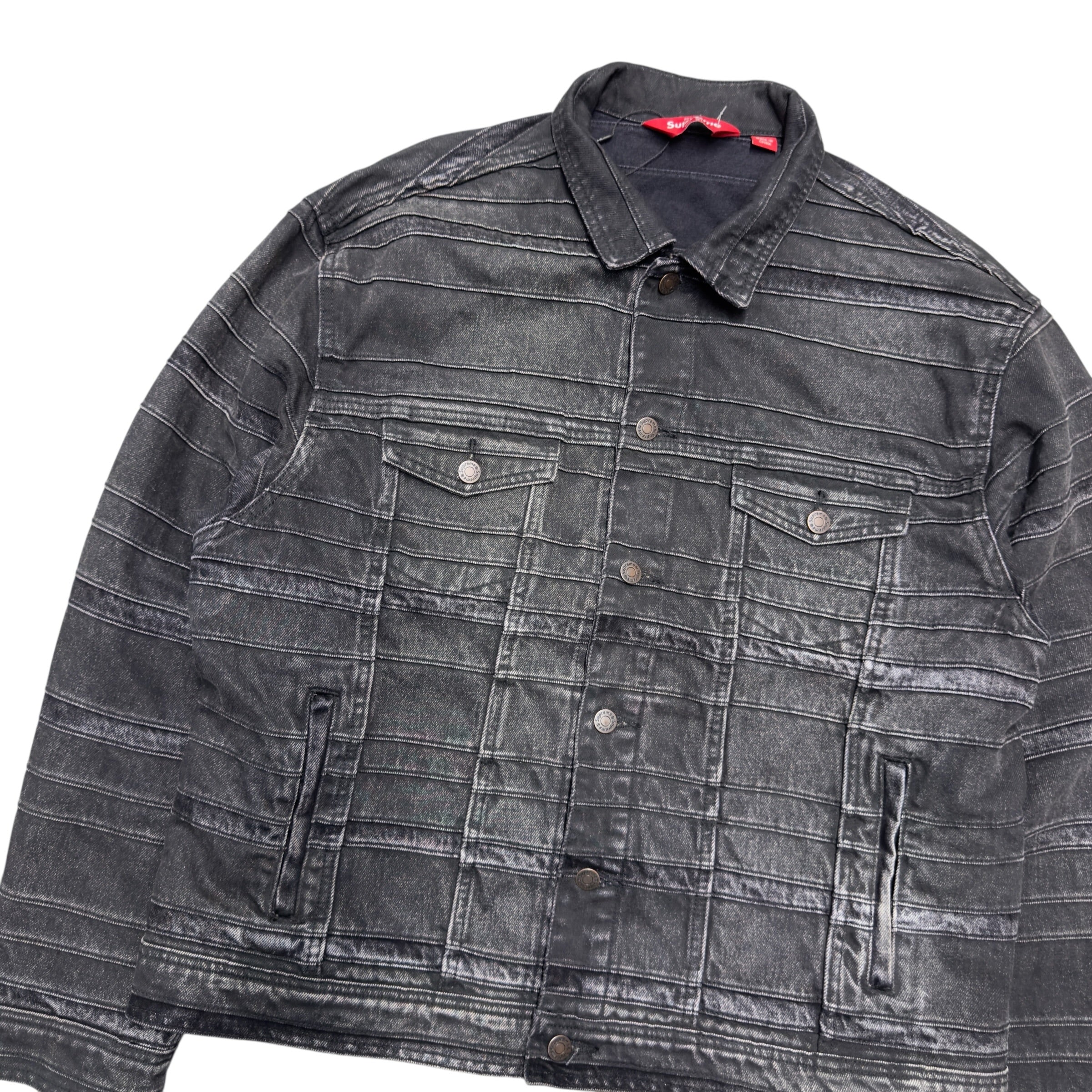 SUPREME LAYERED DENIM TRUCKER JACKET.