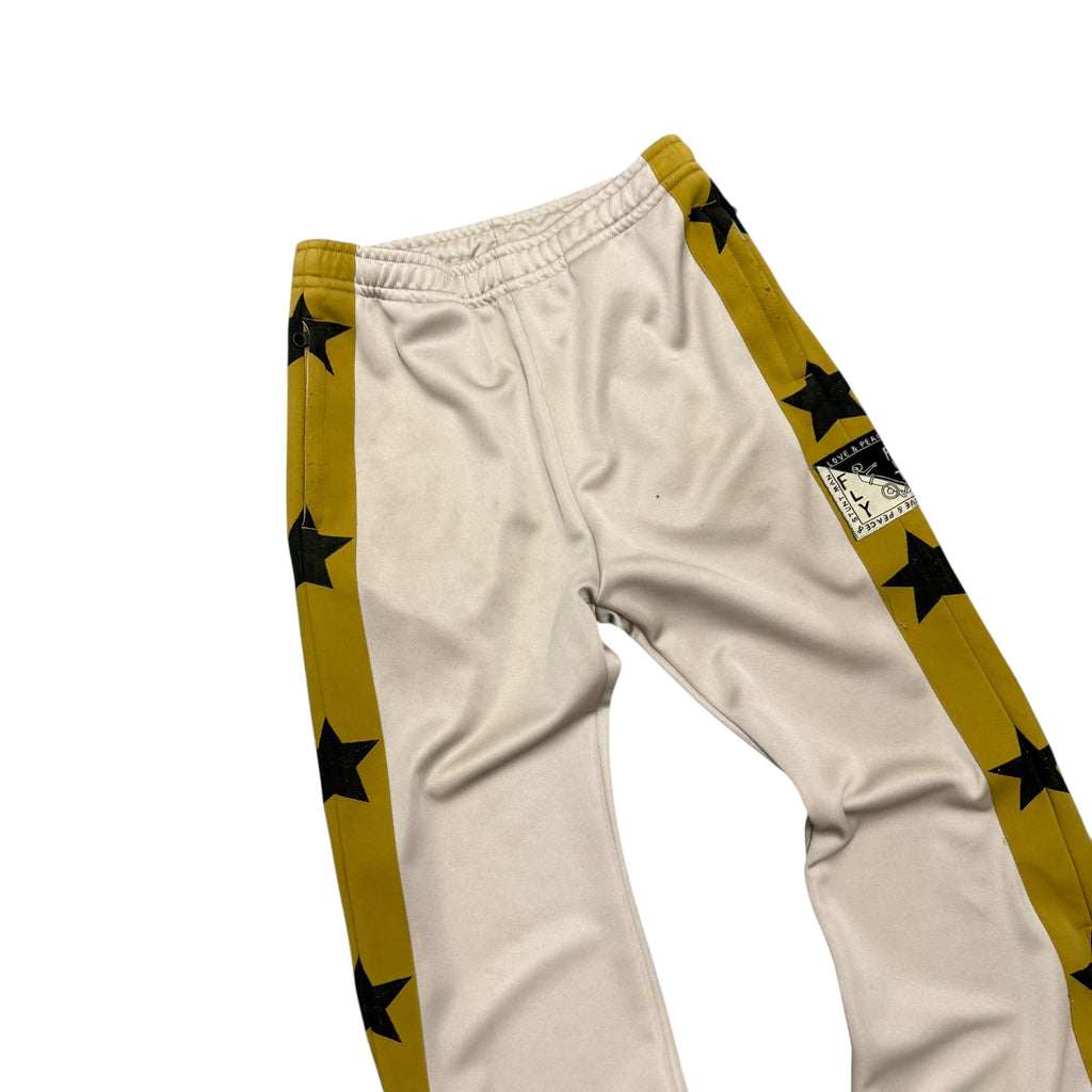 KAPITAL YELLOW & BLACK STAR SWEATPANTS.
