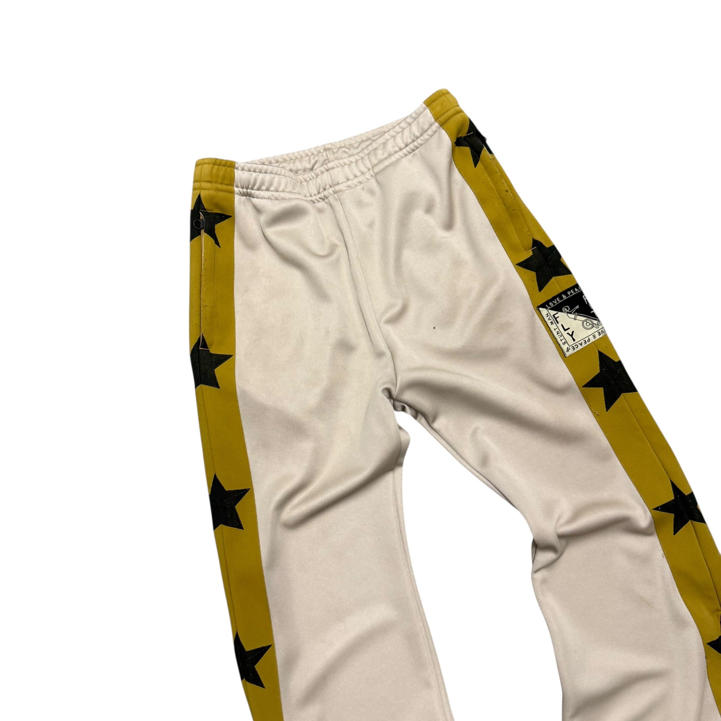 KAPITAL YELLOW & BLACK STAR SWEATPANTS.