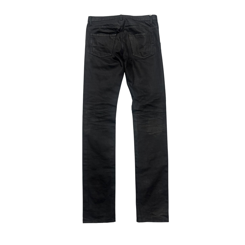 DIOR DISTRESSED BLACK WAXED DENIM PANTS.