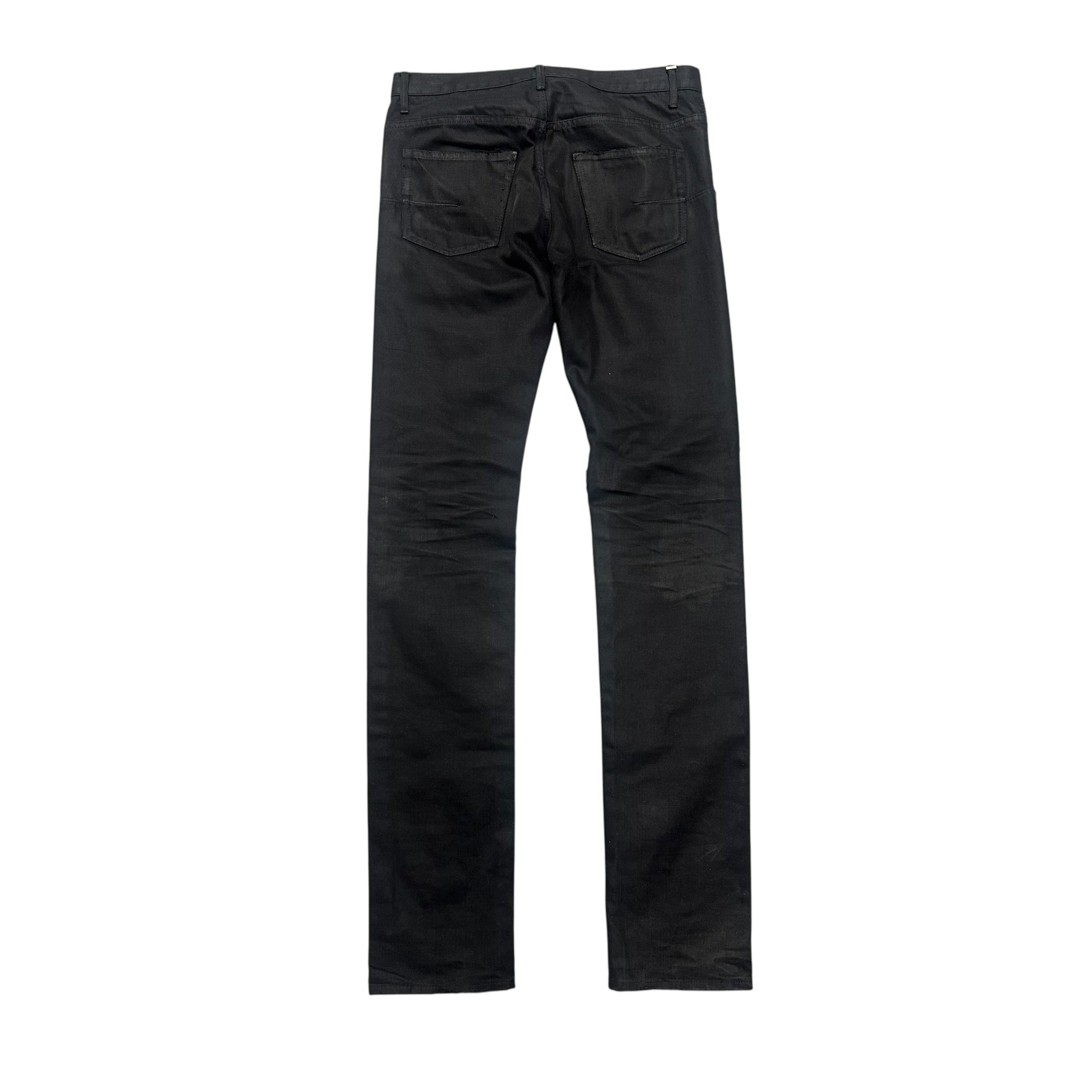DIOR DISTRESSED BLACK WAXED DENIM PANTS.