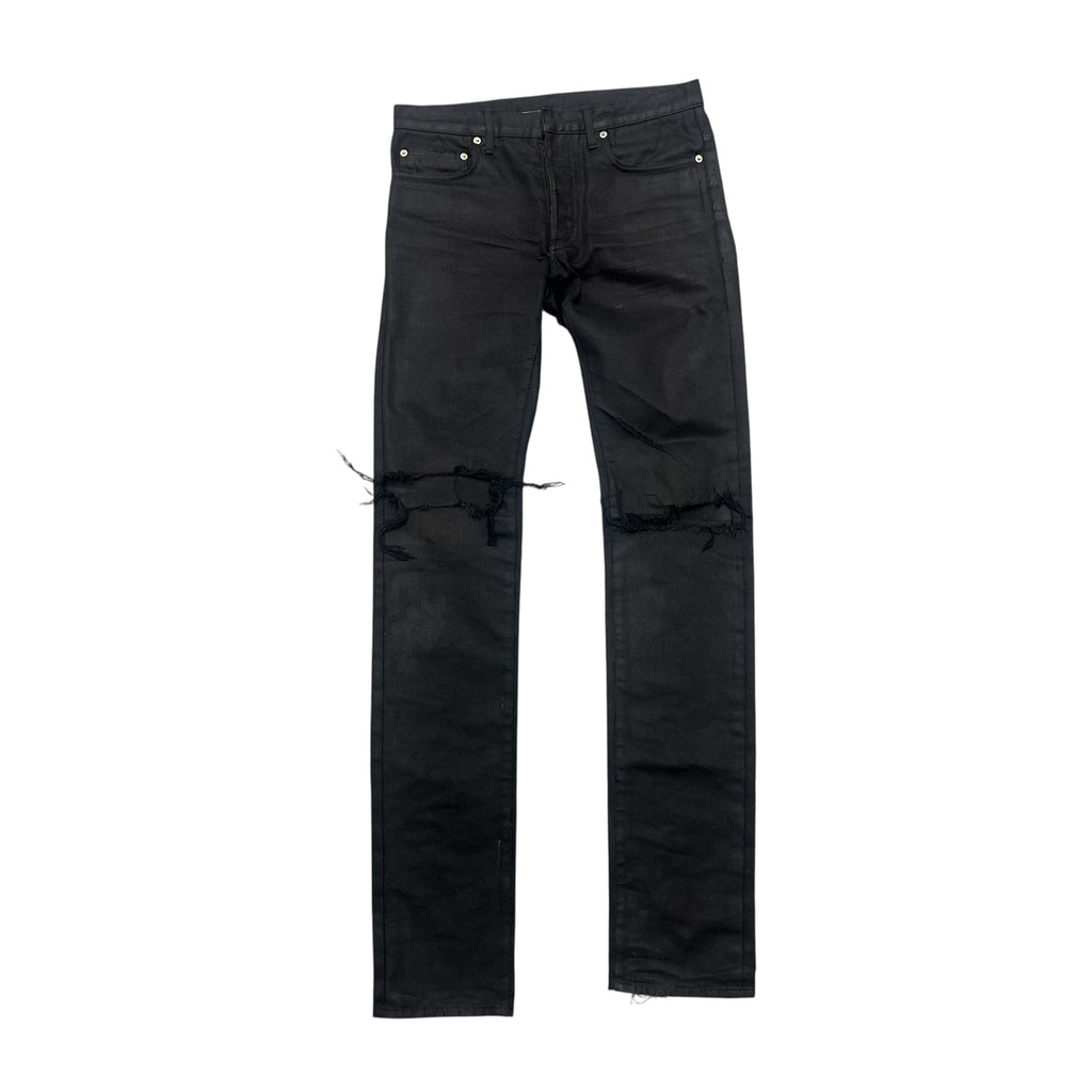 DIOR DISTRESSED BLACK WAXED DENIM PANTS.