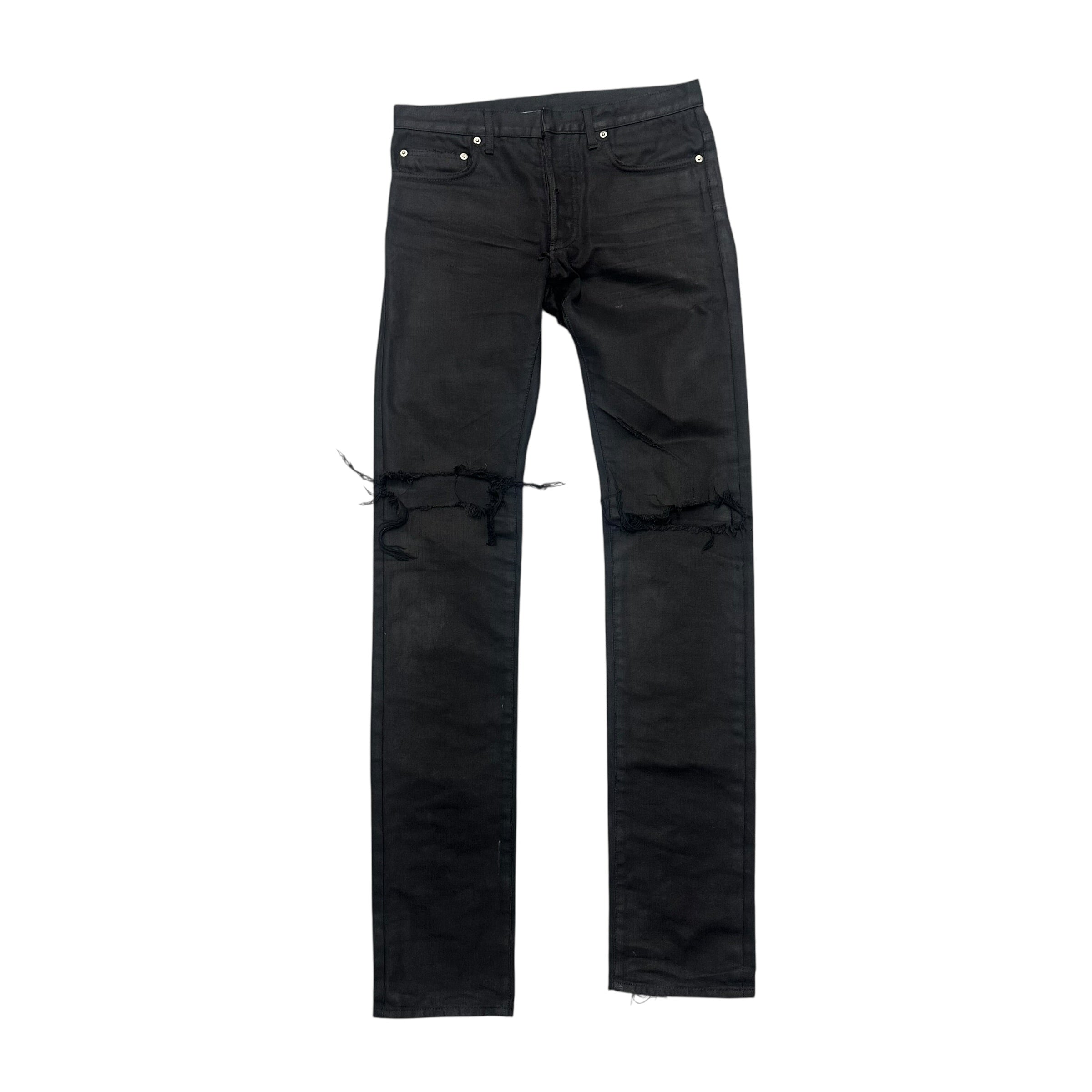 DIOR DISTRESSED BLACK WAXED DENIM PANTS.