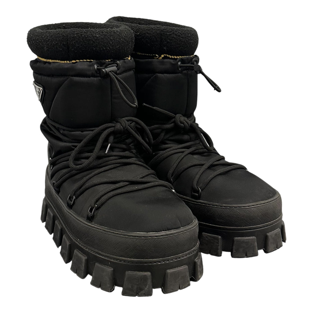 PRADA PADDED MONOLITH APRE SKI BOOTS.
