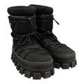 PRADA PADDED MONOLITH APRE SKI BOOTS.
