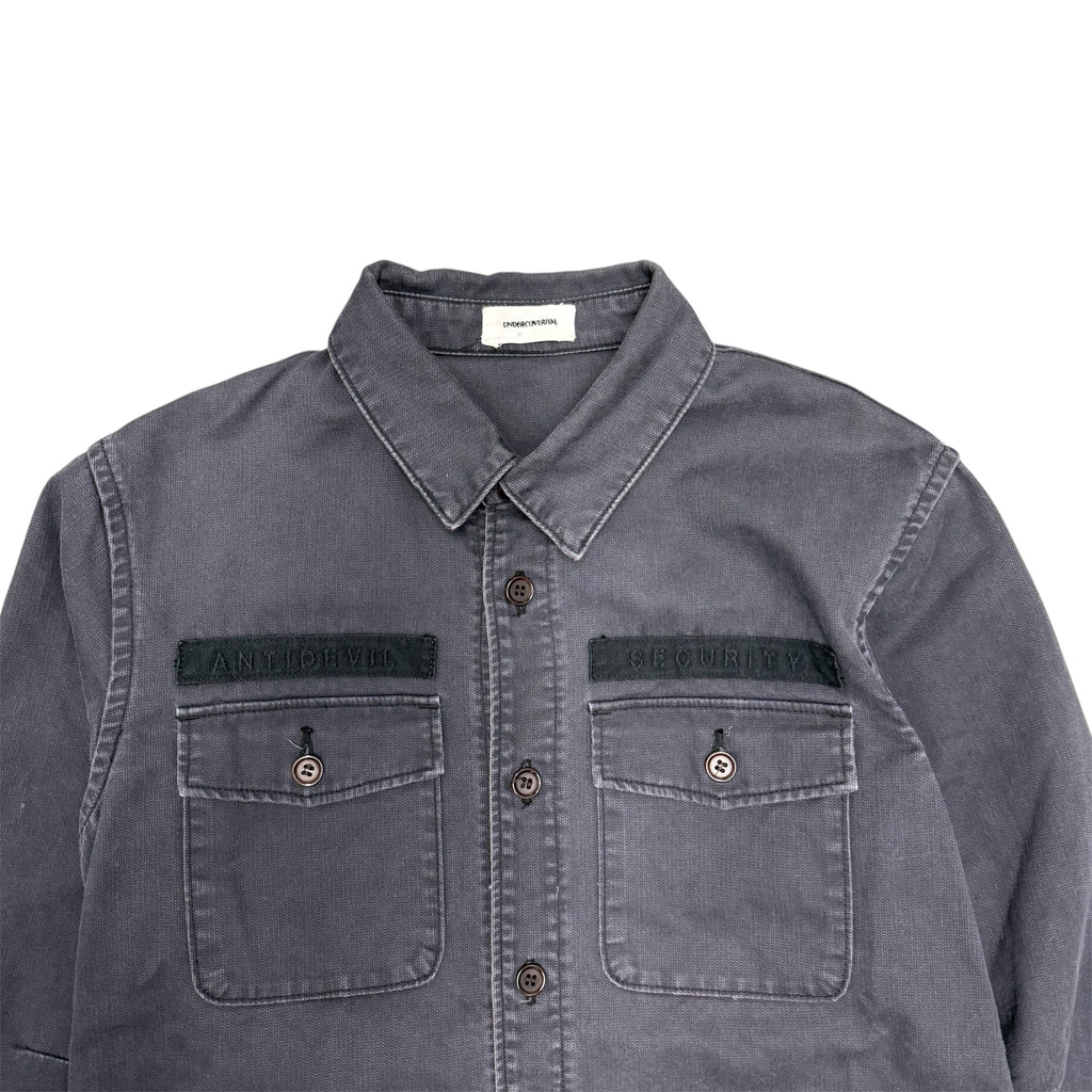 UNDERCOVER ANTI DEVIL SECURITY MILITARY FATIGUE SHIRT.