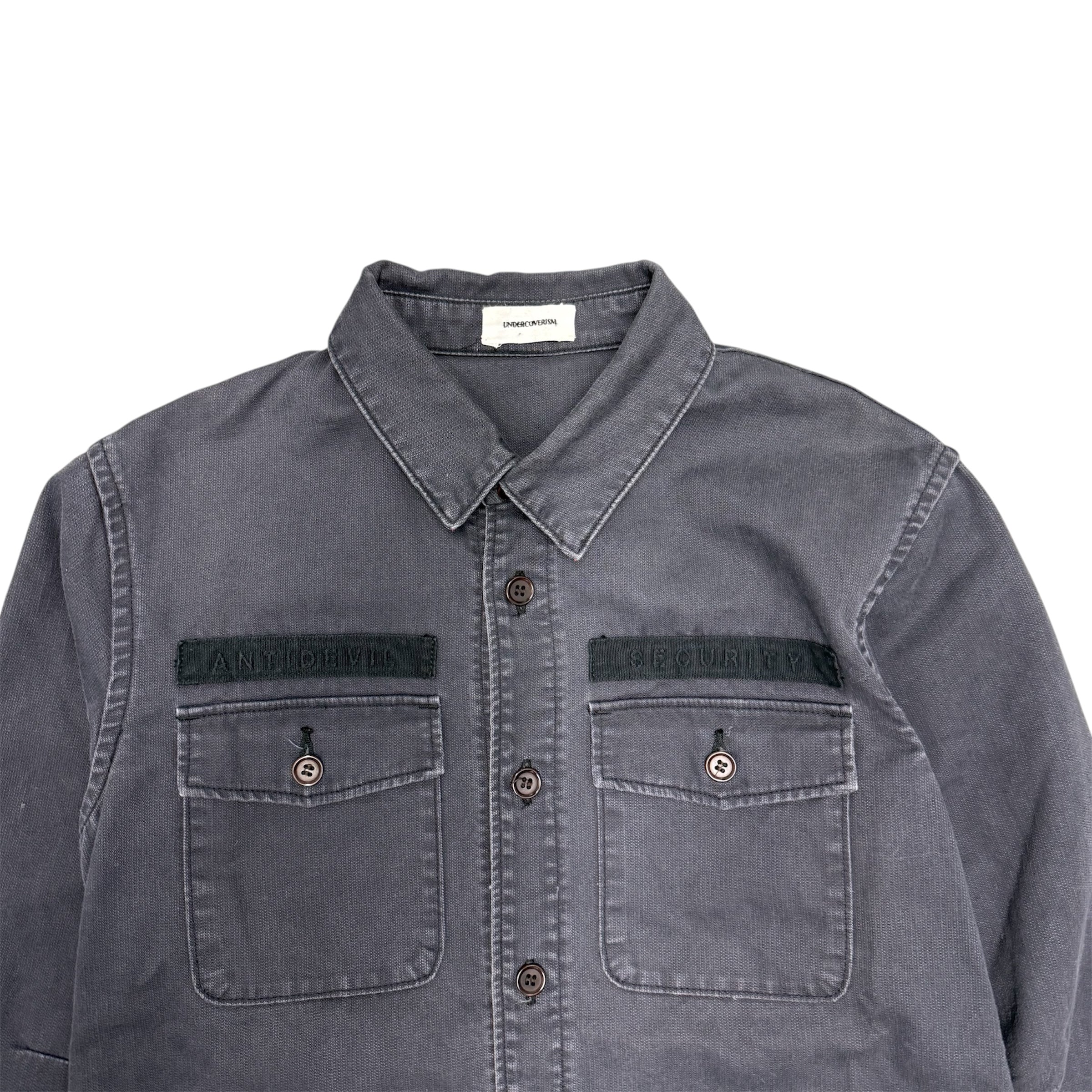 UNDERCOVER ANTI DEVIL SECURITY MILITARY FATIGUE SHIRT.