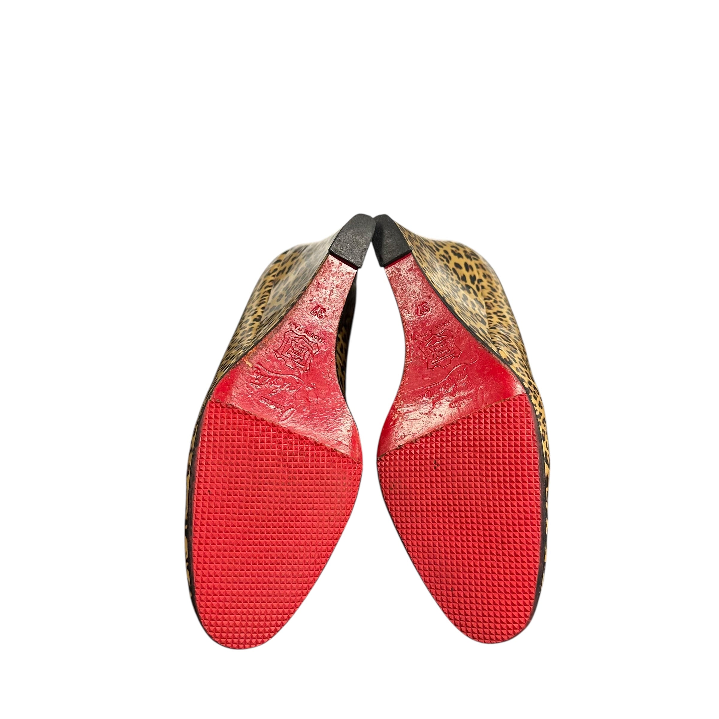 CHRISTIAN LOUBOUTIN RED BOTTOM HEELS.