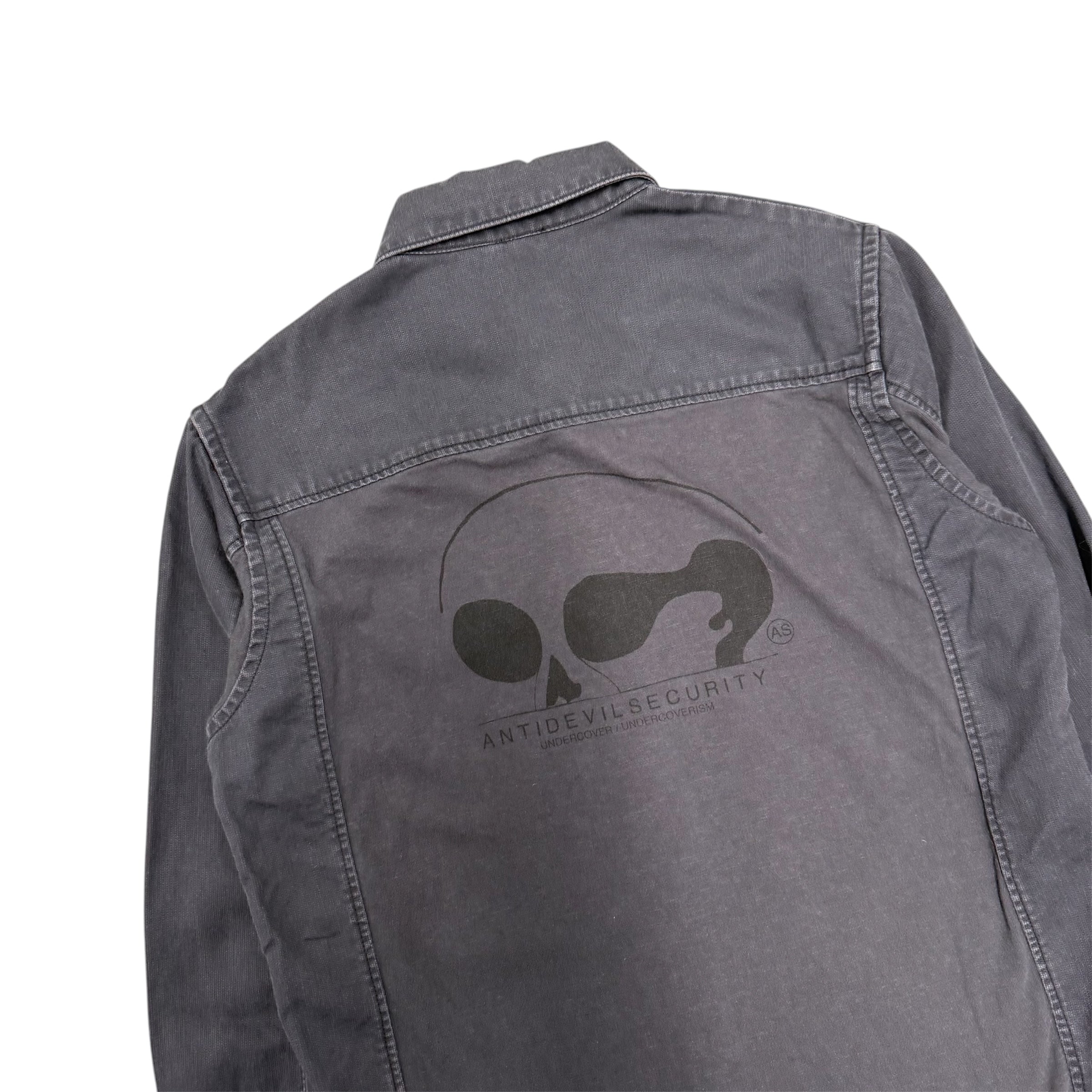 UNDERCOVER ANTI DEVIL SECURITY MILITARY FATIGUE SHIRT.