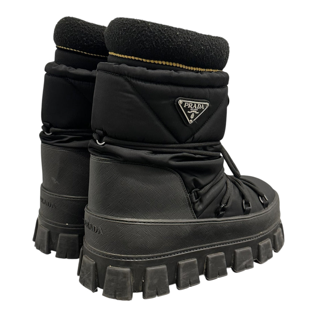 PRADA PADDED MONOLITH APRE SKI BOOTS.