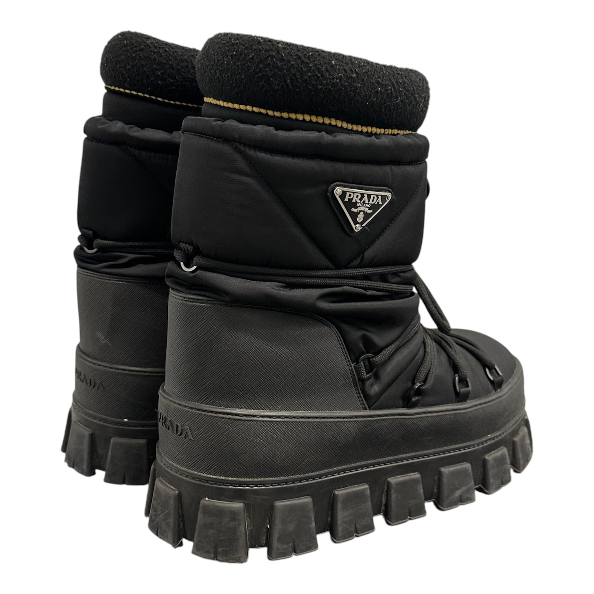 PRADA PADDED MONOLITH APRE SKI BOOTS.